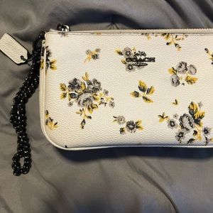 Coach Wristlet with cute yellow, grey, black, floral print. Fit’s iPhone 14 ezy.